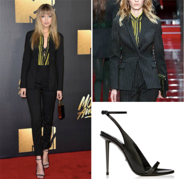 Tại sự kiện MTV Movie Awards, Gigi biến hóa hình ảnh mạnh mẽ với phong cách menswear khi diện bộ suit kẻ sọc của Versace và giày sandals từ nhà mốt Tom Ford. 